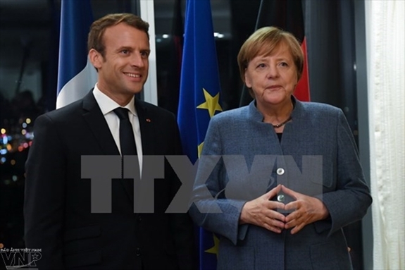 Tổng thống Pháp Emmanuel Macron và Thủ tướng Đức Angela Merkel. Ảnh: TTXVN
